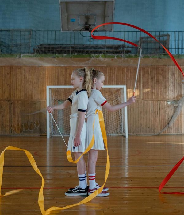 Person practicing slow rhythmic movements in a dark room